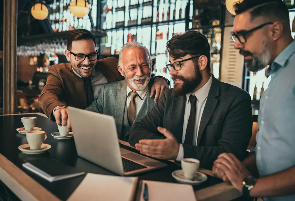 group of positive man having good time together